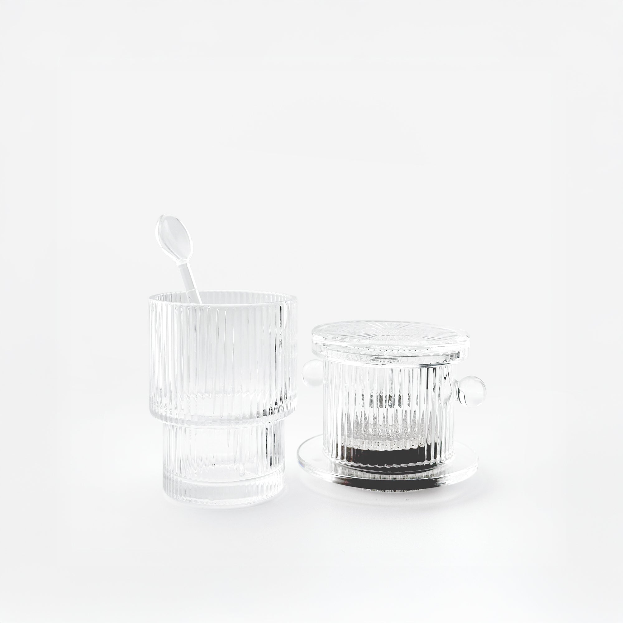 Vietnamese drip coffee brew set with the original glass phin, a reeded double-wall glass, and a matching spoon.